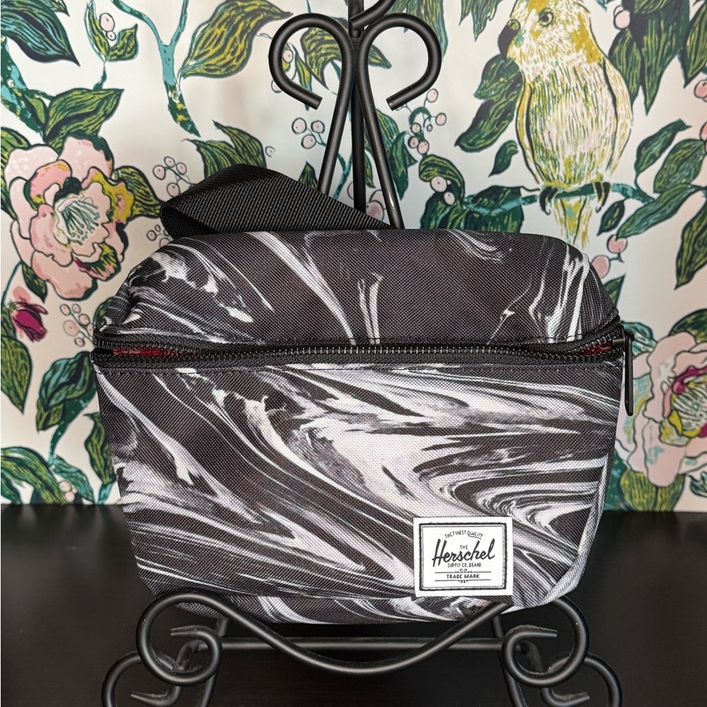 Never used Herschel Fanny Pack black with swirl print.